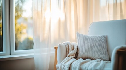 Cozy armchair near window bathed in sunlight