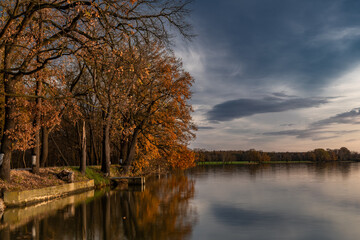 Vysatov pond with sunset color light in autumn sunny evening