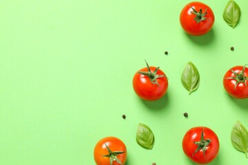 Fresh red tomatoes, pepper and basil on color background, top view