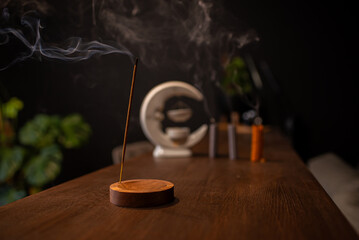 Burning aromatic incense smoky stick for meditation and relaxing. Aromatherapy smoke for yoga concept.