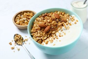 Delicious granola with yogurt on the table