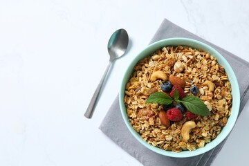 Delicious granola with berries and yogurt on the table