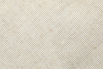 Beige fabric background, close up view