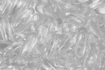 Transparent white pills background texture. colorless tablets