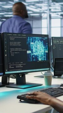 Vertical video Engineer in data center implementing advanced AI driven predictive maintenance systems to proactively identify and resolve potential hardware failures before they impact operations