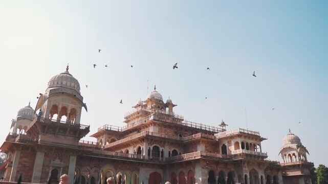 Albert Hall Museum with birds flying in sky at Jaipur, Rajasthan, India. Building exterior. Tourism and holidays concept.