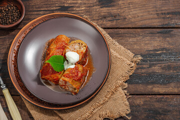 Cabbage rolls stuffed with rice and meat stewed in tomato sauce. Traditional dish, ready-to-eat food