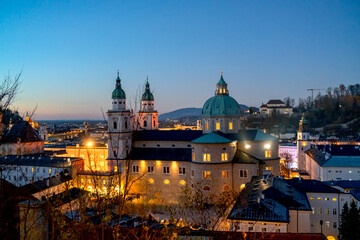 Fototapeta premium Beautiful ancient Salzburg Cathedral, Christmas illumination in the evening. Christmas holiday in Europe 
