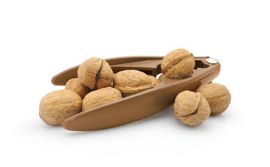 Whole walnuts with brown plastic lever nutcracker isolated on white background	      