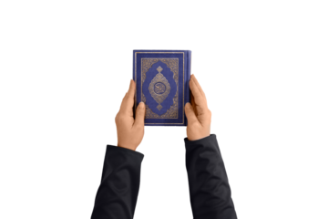 Female hands holding the Quran. Book with Arabic title All Quran. Muslim religious scripture. Isolated background.