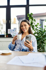 Obraz premium Brunette woman smiles as she relaxes with coffee and her phone in a bright cafe ambiance.
