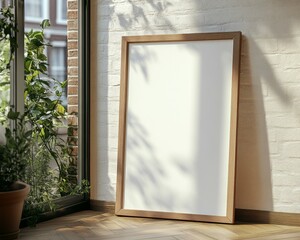 Wall art empty picture frame mockup on wooden desk, wall, table. Vase with olive branches, cactus. Elegant working space, home office concept.