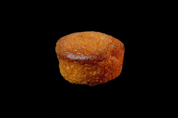 Cupcake filled with jam inside. black background