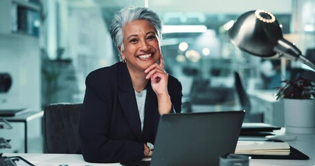 Mature face, businesswoman and smile with laptop for stock market trends and cryptocurrency investment. Night trading, portrait and happy employee with online portfolio review and NFT account at desk - Powered by Adobe