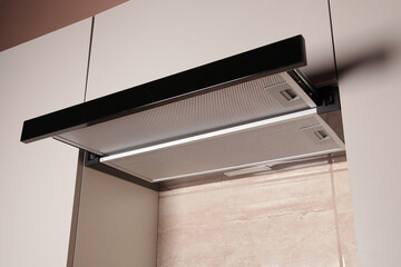 Modern Range Hood. Cooking Hood. Kitchen with Modern interior light beige color and Household...