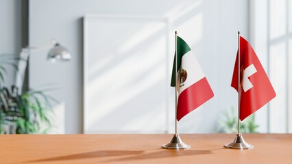 FLAGS OF MEXICO AND SWITZERLAND ON TABLE