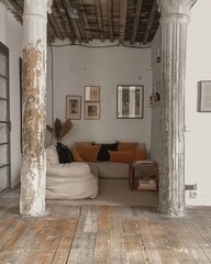 Two large framed portraits grace the wall, adding a touch of elegance to the room