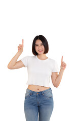 portrait of a Happy Asian woman smiling points her index finger at an empty space in the background and looks straight ahead on white background