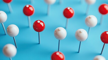 Red and white pins, top view, in blue background