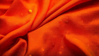 High-resolution image of an orange fabric texture with visible threads and fabric texture