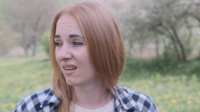 Young woman's facial expressions reflecting disgust in slow motion