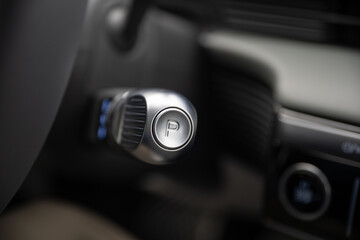 Closeup view of a park mode button on an electric vehicle