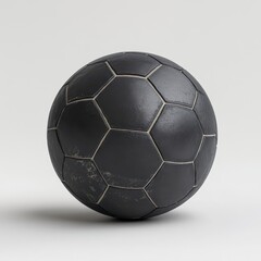 An isolated black soccer ball set against a pristine white backdrop.