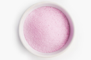 powder pink matcha tea in a white bowl