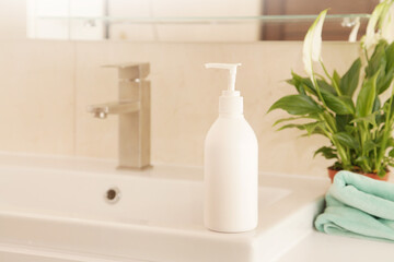 Washing of Hands, Mock up Bottle with Soap or Cream on white Sink, Green Plant. Eco Concept Hygiene