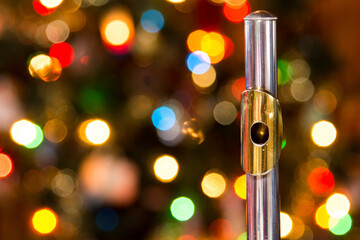 a flute with a christmas tree in the background © Blessings Captured