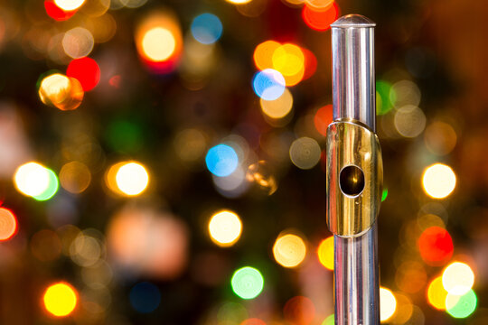 a flute with a christmas tree in the background