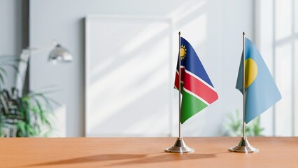 FLAGS OF NAMIBIA AND PALAU ON TABLE