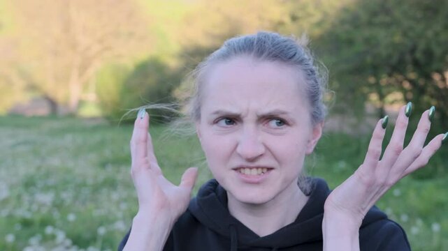 Woman displays confusion and frustration through a range of emotions, captured in slow motion for dramatic effect
