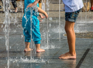 Kids playing in fountainn