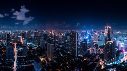 Skyline view of a bustling city illuminated at night with vibrant lights and skyscrapers showcasing urban development
