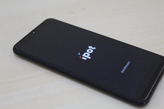 IPOT app logo display on a smartphone. IPOT app by Indo Premier Investment from Indonesia