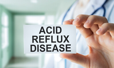 ACID REFLUX DISEASE text is written in a notebook. Medical concept.