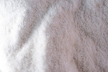 white plush fabric texture background , background pattern of soft warm material