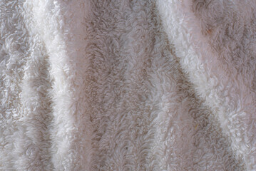 close-up of wool with a fluffy texture, the focus is on the intricate fibers, highlighting its warmth and comfort