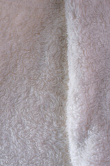 close-up of wool with a fluffy texture, the focus is on the intricate fibers, highlighting its warmth and comfort