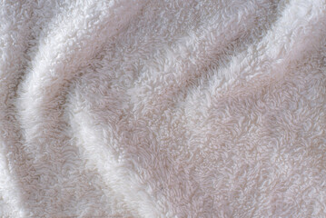 close-up of wool with a fluffy texture, the focus is on the intricate fibers, highlighting its warmth and comfort