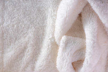 close-up of wool with a fluffy texture, the focus is on the intricate fibers, highlighting its warmth and comfort