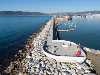 Aerial view of the new waterfront built on the breakwater of the commercial port of Marina di Carrara, in Tuscany