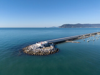 Aerial view of the new waterfront built on the breakwater of the commercial port of Marina di Carrara, in Tuscany