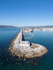 Aerial view of the new waterfront built on the breakwater of the commercial port of Marina di Carrara, in Tuscany