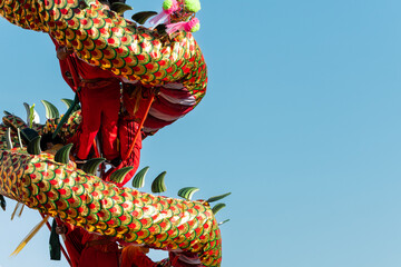 Chinese dragon dance show on street in the Chinese New Year festival.Chinese dragon costume used...