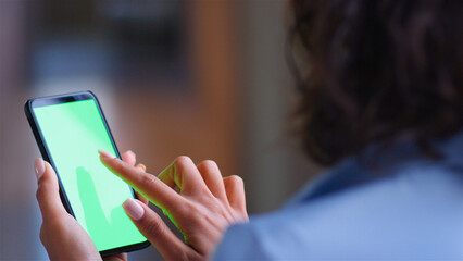 Over The Shoulder Close Up Shot Of Businesswoman Using Green Screen Mobile Phone