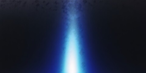 Cool blue light from an LED flashlight on a white wall. A ray of light on the surface