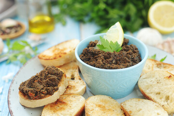 A bowl with tapenade - traditional olive dip in Mediterranean region	