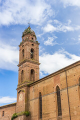 Tower of the historic Pian Mantellini church in Siena, Italy